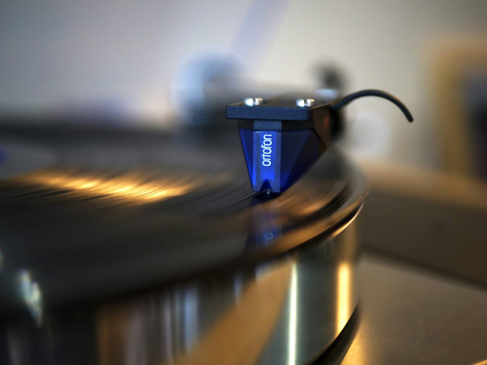 blue and silver coffee cup on stainless steel round tray